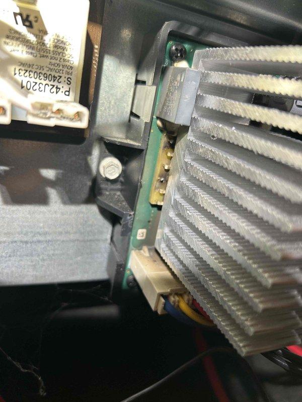 Responded to callback for downstairs HVAC system non-responsive since previous maintenance. Diagnosed issue with control board and heat sink assembly; inspection revealed loose connections and overheating components. Reseated wiring connections, cleaned heat sink fins, and restored proper system function with thermostat now communicating correctly.