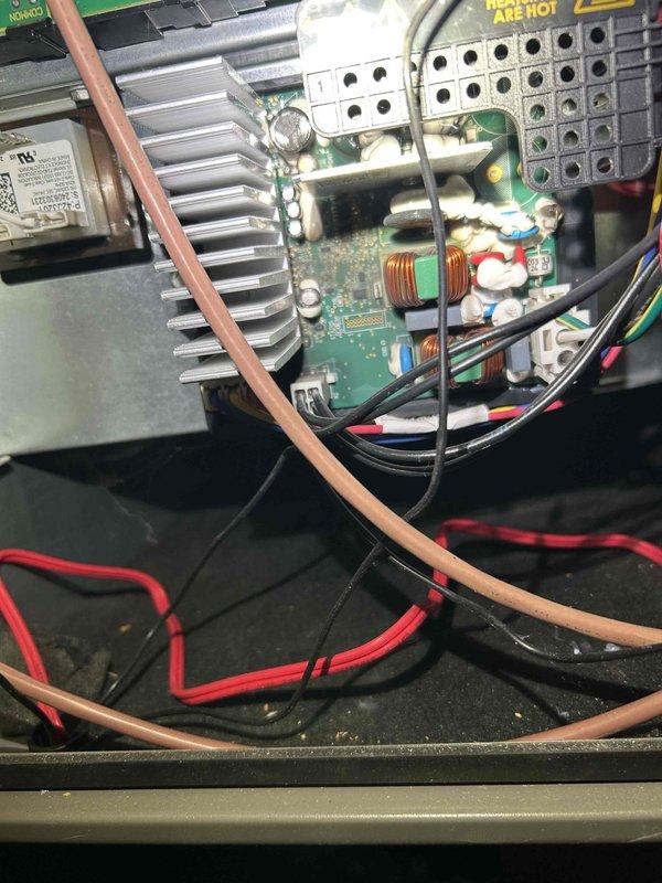 Responded to callback for downstairs HVAC system non-responsive since previous maintenance. Diagnosed issue with control board and heat sink assembly; inspection revealed loose connections and overheating components. Reseated wiring connections, cleaned heat sink fins, and restored proper system function with thermostat now communicating correctly.