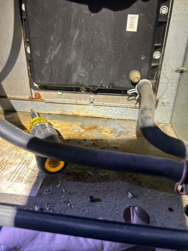 Responded to no heat complaint for 125+ year old gas heating system. Upon inspection, found significant corrosion and rust on the heat exchanger and internal components. System exhibited signs of advanced age with deteriorated hoses and connections. Determined unit had failed due to end-of-life conditions and recommended replacement rather than repair.