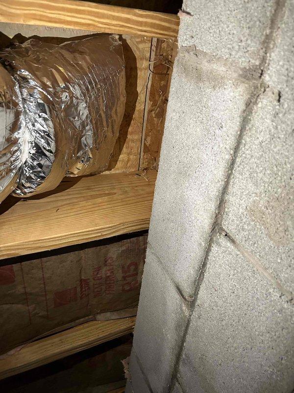 Completed insulation of all exposed metal ductwork in crawlspace including boots and panning per inspector requirements. Added proper wooden supports to duct system to replace webbing supports. All modifications were performed to meet code requirements for rough-in inspection approval.