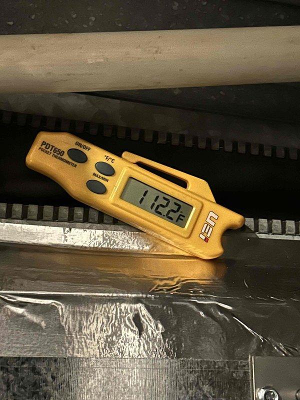Responded to callback for downstairs system (installed May 2025) not heating and displaying "GF Heat airflow below minimum" error. Diagnosed issue with dirty AprilAire 410 filter restricting proper airflow. Verified system operation after filter replacement with supply air temperature reading 112.2°F. System now maintaining proper temperature differential and heating to customer's desired setpoint of 75°F.