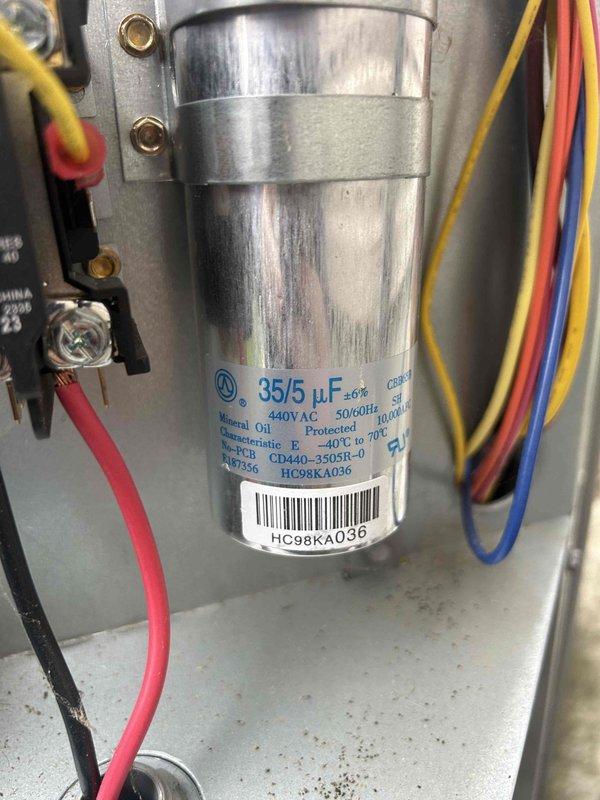 Performed Gold Level maintenance service on single-system heat pump/air handler located in attic. Inspected and tested capacitor (35/5 μF, 440VAC) using Fieldpiece multimeter with reading of 0.6 amps. System operating within normal parameters with all electrical connections secure.
