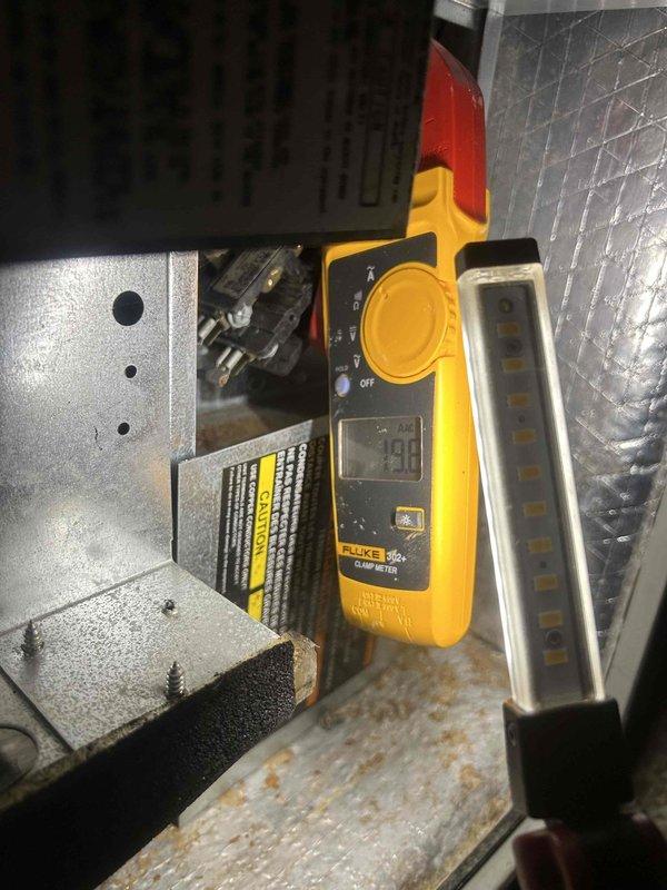 Performed scheduled Care Plan Tune Up on heat pump/air handler system located in crawlspace. Conducted electrical diagnostics with multimeter showing 199 reading during system check. Verified customer-supplied filter (20"x25"x1") was properly installed with correct airflow direction.