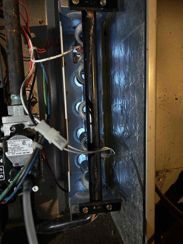 Performed Care Plan AC/GF tune-up on unit located in crawlspace. Inspected interior components including electrical connections and control module. Conducted amperage testing with clamp meter, confirming system is drawing 30.4 amps during operation. Customer will provide their own 20x25x1 filter as specified.