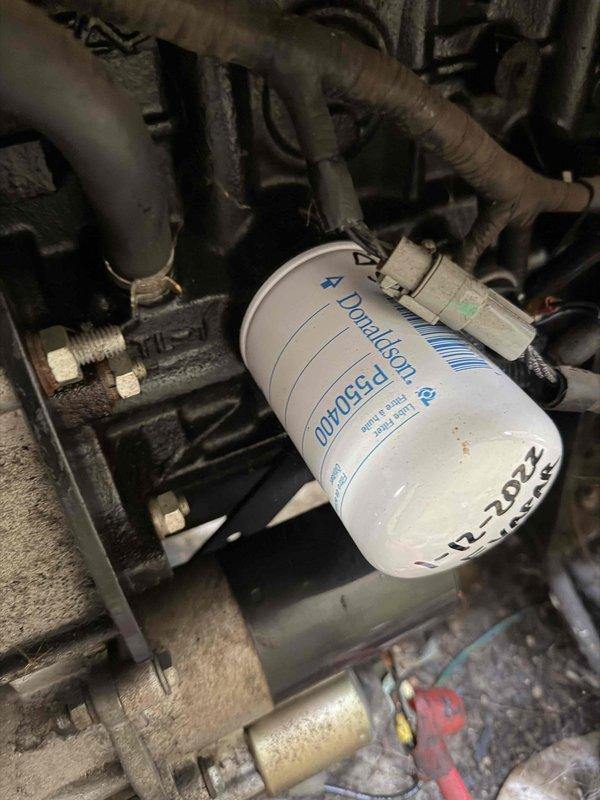 Performed scheduled maintenance service on Generac 120V/240V 104A generator (S/N: 4681100). Inspected and replaced air filter element which showed signs of contamination. Changed oil filter (Donaldson) as part of preventative maintenance protocol. All systems tested and verified operational.