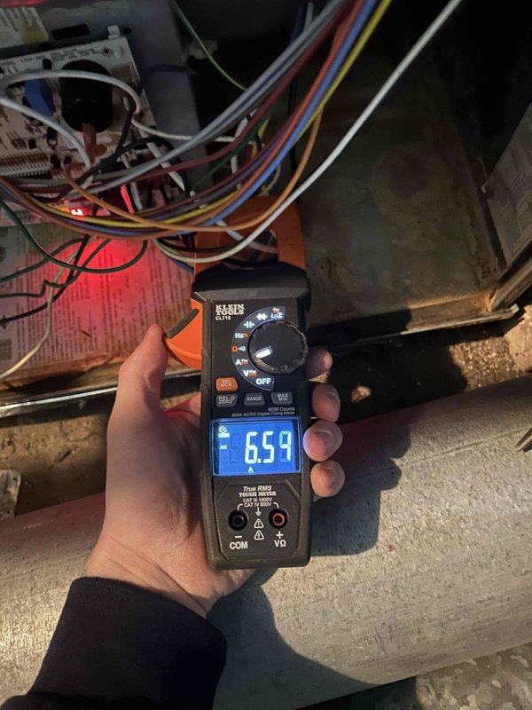 Performed annual Care Plan tune-up service on 4-year-old AC/GF system located in cellar. Conducted electrical diagnostics with clamp meter, recording readings of 8.40 amps and 6.59 amps at key test points. Customer-provided filter was installed during maintenance.