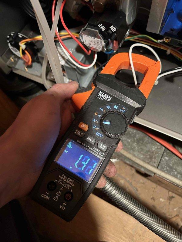 Performed scheduled Care Plan tune-up on customer's AC system. Conducted electrical measurements with clamp meter, recording amperage readings of 17.7A. Inspected interior components including wiring connections and metal chassis. Customer provides own filter; service completed after 2:30pm as requested.