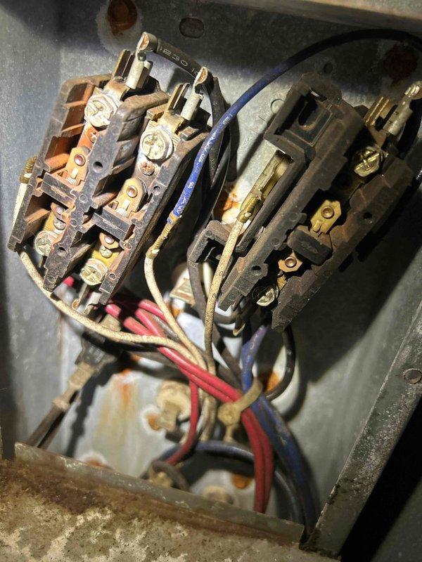 Performed scheduled Care Plan Tune Up on dual AC and gas furnace systems. Service required two technicians to access equipment located on roof and in basement. Inspected electrical contactors in control panel showing signs of oxidation and wear. Documented condition of aging electrical components with photos for future reference.