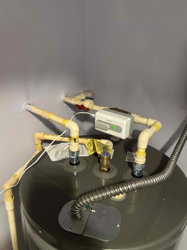 Completed installation of a Rheem Classic 50-gallon electric water heater with auto shut-off valve system in Unit #304. Installed drain pan, connected to existing water lines and electrical service, and properly disposed of the old unit. All work completed according to KY Division of Plumbing standards with appropriate permits and inspections.