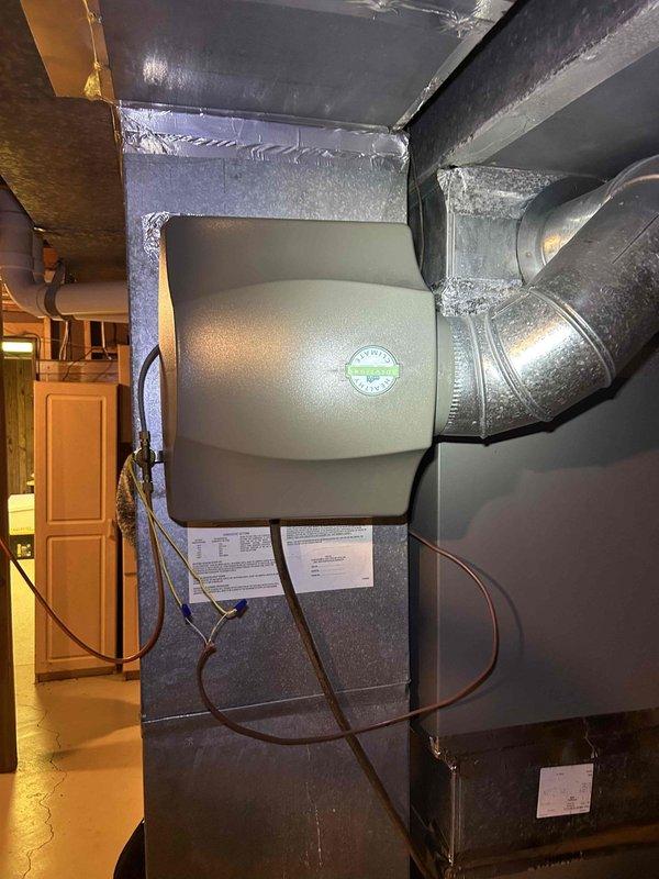 Performed scheduled care plan tune-up on basement AC/GF unit. Inspected blower wheel assembly and found it in good operational condition with no abnormal buildup or damage. Examined ductwork connections and seals, which were properly secured with metal tape. Replaced customer-provided 16x25x1 air filter as part of maintenance service.