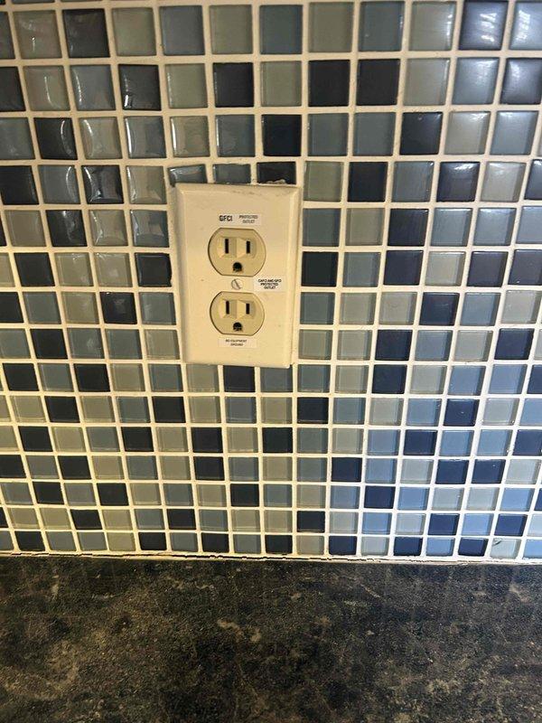 Responded to service call regarding ungrounded receptacles and open ground conditions. Performed assessment of multiple electrical outlets including two-prong and three-prong receptacles throughout the property. Corrected loose receptacle installation and addressed GFCI with open ground condition. Evaluated unused breaker in panel and made necessary adjustments to ensure code compliance.