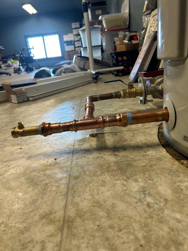 Successfully removed 80-gallon electric water heater and installed new 50-gallon tall electric water heater per specifications. Completed all necessary copper pipe connections with brass fittings, reconnected to existing water lines and electrical service, and verified proper operation with no leaks before departure. Disposed of old unit and filed required KY Division of Plumbing permit documentation.