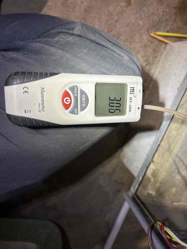 Responded to no-heat complaint on 14+ year old gas furnace that was shutting down after approximately one minute of operation. Diagnostic testing with manometer revealed gas pressure reading of 100, indicating proper supply to the unit. Visual inspection of burner assembly showed normal blue flames, but identified significant corrosion and rust on gas line connection to Honeywell control valve. Cleaned corroded connections, verified proper operation of control module, and restored system functionality with continuous operation through multiple test cycles.