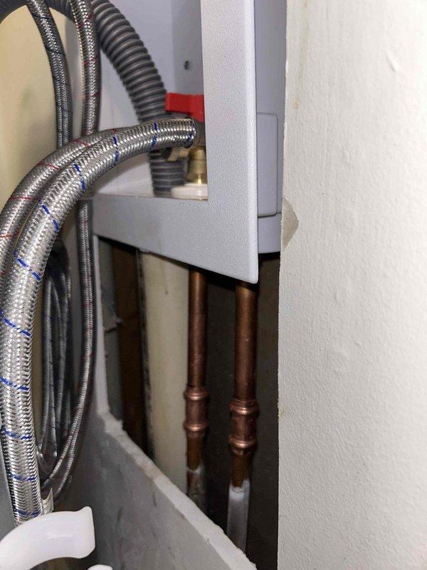 Diagnosed and repaired low water pressure issue affecting washing machine. Accessed wall cavity to inspect plumbing infrastructure, discovered partial blockage in supply lines. Cleared obstruction in the braided stainless steel supply hoses and verified proper water flow to all fixtures.