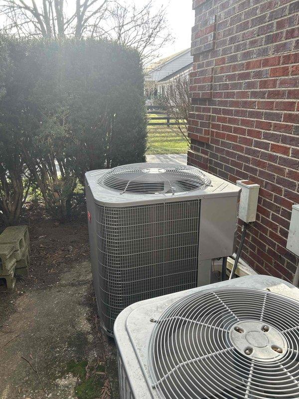 Performed Club Duo maintenance service on customer's heat pump system with air handler. Inspected both outdoor condensing units located on concrete pad adjacent to home's brick exterior. Verified filter sizes (24x24x1 for crawlspace unit and 18x20x1 for upstairs unit) and provided replacement filters as requested by customer.