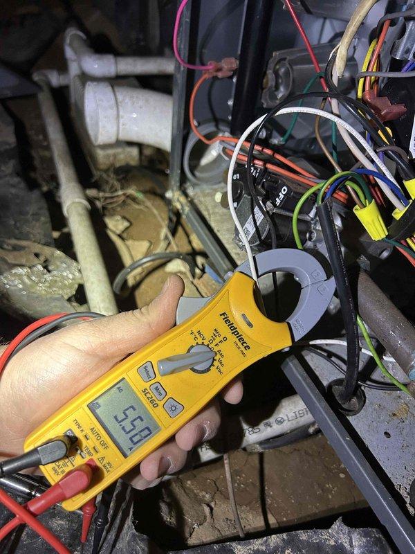 Performed scheduled care plan tune-up on customer's HVAC system. Inspected heat exchanger for proper operation and replaced customer-provided filters. Conducted electrical diagnostic testing with clamp meter, measuring 5.99 amps during operation to verify system is functioning within normal parameters.
