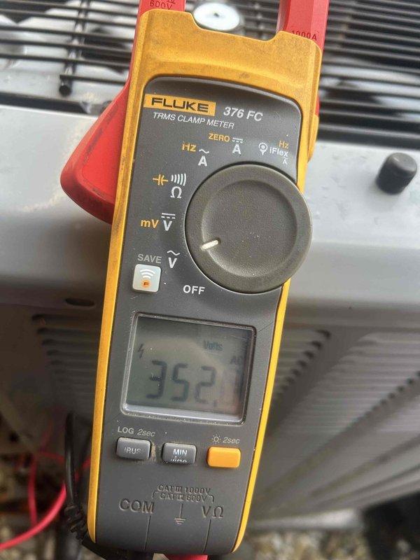 Performed annual club maintenance on 2021 heat pump/air handler system. Inspected and replaced standard pleated filter with new one as customer had switched from washable type. Conducted electrical diagnostic testing with Fluke 376 meter, confirming proper voltage reading of 352V at the unit.