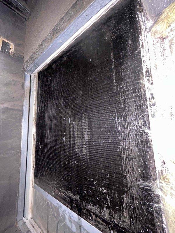 Performed extensive cleaning of severely contaminated evaporator coil on downstairs HVAC system. Coil surfaces were completely obstructed with heavy dirt/debris accumulation, significantly impairing airflow and system efficiency. Installed replacement double joist panning metal to restore proper system function. Total service time: 2 hours (1 technician).