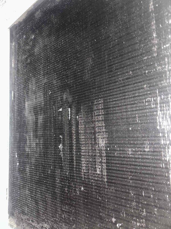 Performed extensive cleaning of severely contaminated evaporator coil on downstairs HVAC system. Coil surfaces were completely obstructed with heavy dirt/debris accumulation, significantly impairing airflow and system efficiency. Installed replacement double joist panning metal to restore proper system function. Total service time: 2 hours (1 technician).