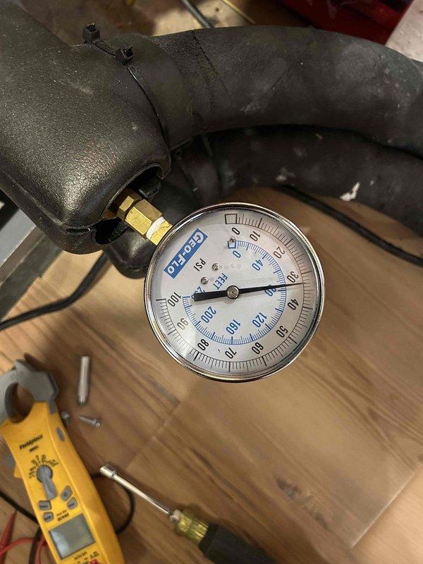 Responded to customer call regarding system issues during scheduled Care Plan Tune Up for geothermal heat pump system. Performed electrical testing with clamp meter, recording amperage readings of 96.8. Checked system pressure using DESCO gauge, ensuring proper operation parameters. Customer advised about washable filter maintenance for indoor air handler units located in basement and second floor closet.
