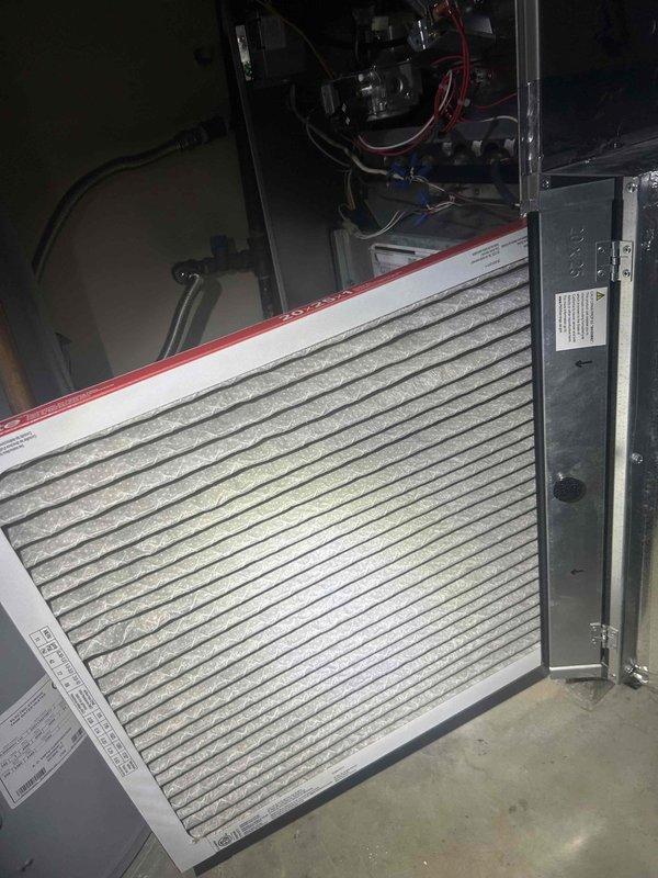 Performed scheduled Care Plan tune-up on AC and gas furnace located in garage. Inspected furnace burners showing proper blue flame pattern and combustion. Replaced customer-supplied air filter which showed moderate dust accumulation. System operating normally with no issues identified.