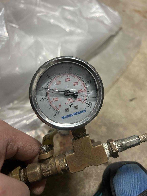 Responded to service call for reported gurgling sounds from geothermal unit. Conducted electrical testing using clamp meter, measuring current draw at 6 amps. Inspected system pressure using gauge, which registered approximately 30-35 PSI (within normal operating range). Determined air was present in the lines as suspected. Purged air from the system, restoring proper circulation and eliminating the gurgling noise.