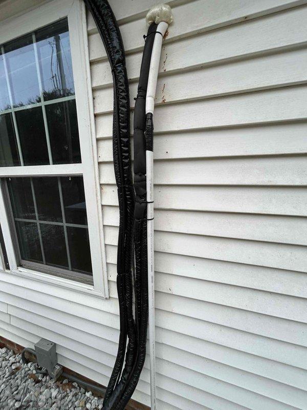 Completed installation of indoor air handler by removing head unit from wall, installing support bracket on wooden mounting board to improve unit levelness, and replacing front cover kickstand in dining/living area. Performed proper refrigerant recovery, conducted triple evacuation, and recharged system to manufacturer specifications. Verified proper operation of outdoor heat pump unit and line set installation.