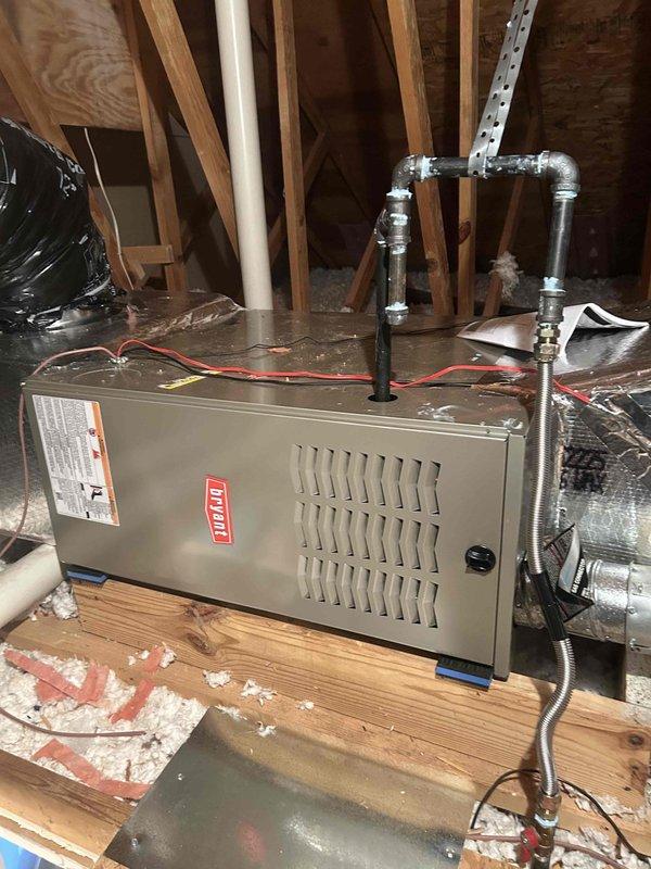 Successfully installed a Bryant 45K BTU 80% efficient single-stage Legacy Series furnace (model 800SB36045M14) in the attic, connecting it to the existing thermostat. Installation included proper ductwork connections, flue piping, electrical and gas shut-off switches, flexible gas line connector, and flame roll-out protection. The system was fully tested and is operating as designed.