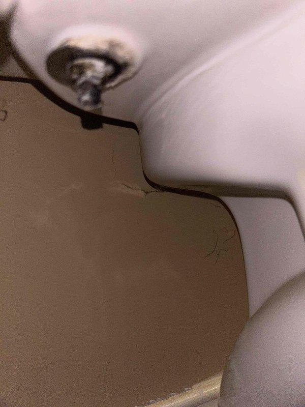 Responded to a water leak service call for an upstairs bathroom toilet. Investigation revealed significant water damage to the ceiling below, with visible staining and saturation. Inspected toilet tank components, finding mineral buildup and wear on the flush valve assembly causing intermittent leakage. Replaced deteriorated flush components and verified proper operation with no further leakage.