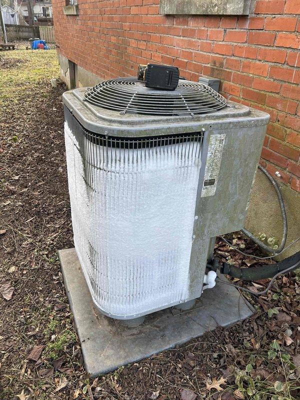 Responded to callback regarding frozen system that was previously serviced in December. Inspection revealed extensive ice accumulation on outdoor unit coils and evaporator. Diagnosed recurring freezing issue caused by malfunctioning condensate pump and restricted drainage. Cleared ice buildup, replaced defective pump, and verified proper system operation before departure.