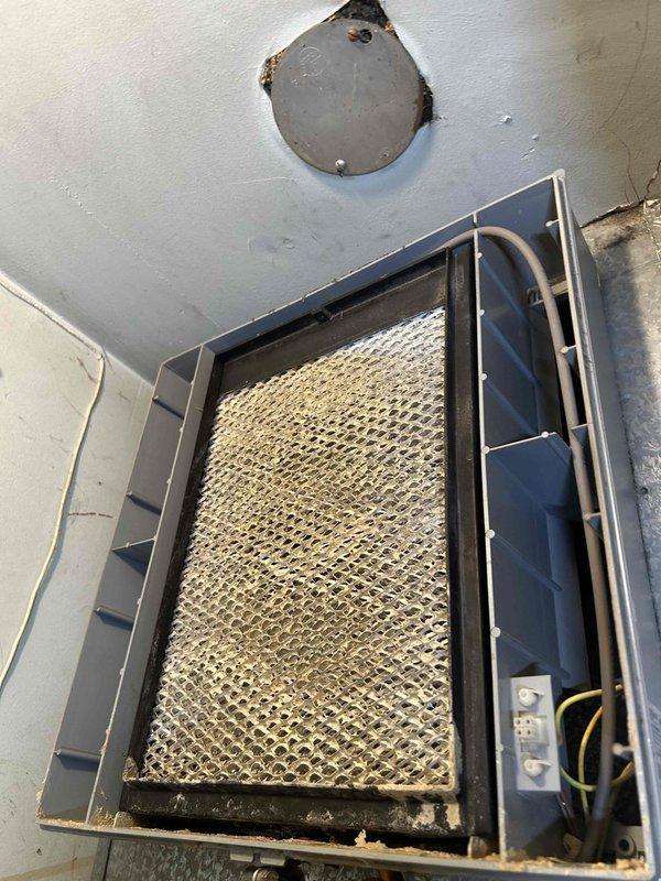 Responded to water leak service call for an HVAC system with an Aprilaire Model 700 automatic humidifier. Upon inspection, discovered significant dust accumulation on the evaporator coil and identified an improperly installed access panel in the ceiling that was contributing to the leak. Cleaned affected components and properly secured the access panel to resolve the water leakage issue.