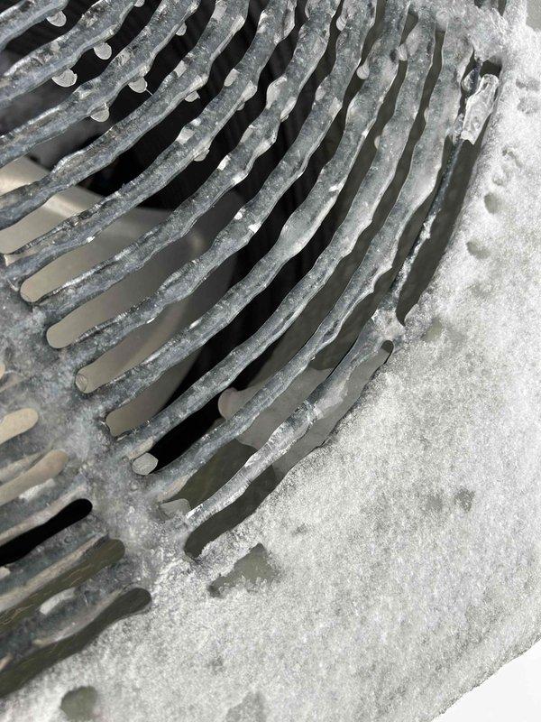Diagnosed and serviced heat pump exhibiting intermittent metal-on-metal noise during operation. Visual inspection revealed severe frost and ice accumulation on evaporator coils and condenser fan grill, significantly restricting airflow and causing system strain. Performed complete defrost cycle, cleaned coils, and verified proper refrigerant levels to restore normal operation and eliminate noise issue.