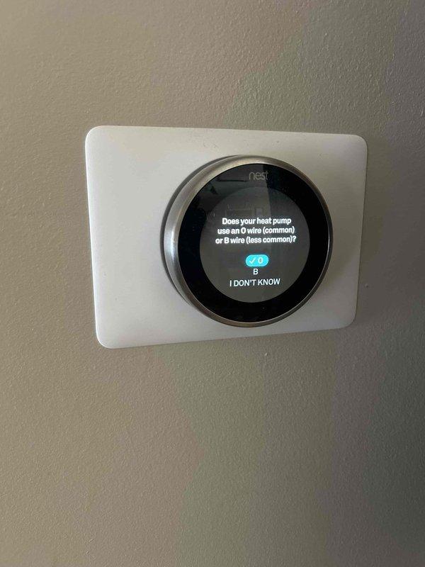 Responded to no heat call for heat pump system with auxiliary heat engaged. Diagnosed system unable to maintain setpoint temperature (61°F actual vs 70°F setpoint). Discovered improper thermostat configuration; reconfigured Nest thermostat O/B wire settings to match system requirements. Verified proper operation after adjustment with heat now maintaining desired temperature.