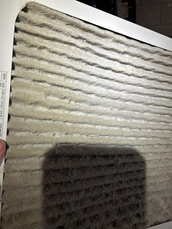Responded to no-heat complaint on electric heat pump system less than 10 years old. Upon inspection, discovered severely clogged air filter causing restricted airflow. Replaced filter and verified proper system operation, restoring heat function.