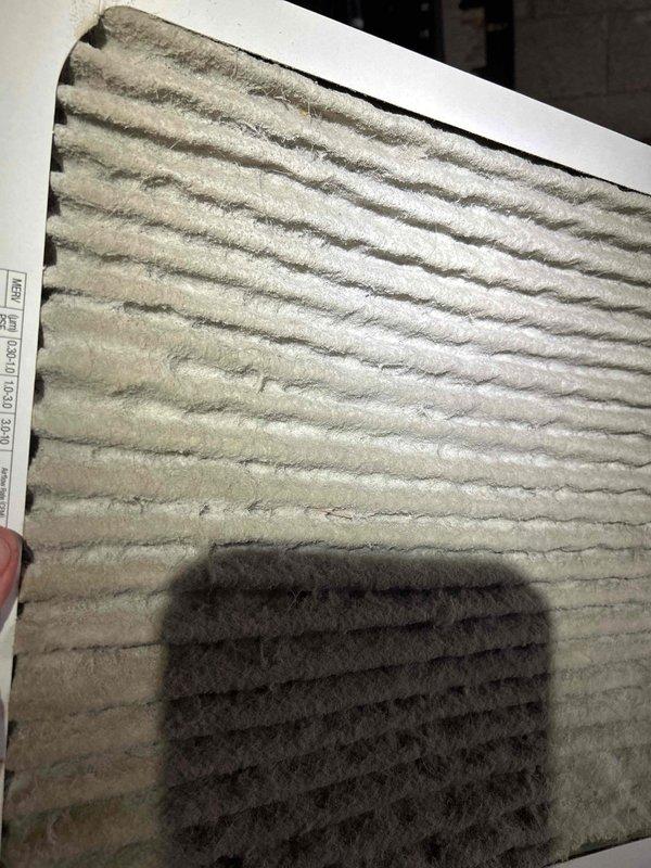 Responded to no-heat complaint on electric heat pump system less than 10 years old. Upon inspection, discovered severely clogged air filter causing restricted airflow. Replaced filter and verified proper system operation, restoring heat function.