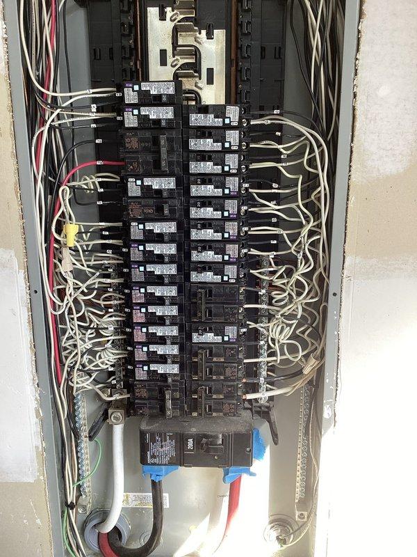Conducted site assessment for Kohler generator installation. Evaluated existing electrical panel configuration, noting current breaker arrangement and available capacity. Inspected exterior mounting location adjacent to electrical meter for proper placement and clearance requirements.