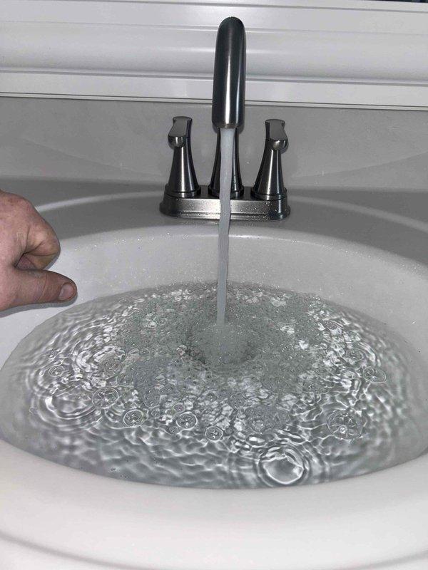 Successfully completed multiple plumbing repairs including removal of test ball and installation of clean-out cap in attic, replacement of bathroom plungers and toilet rebuild components, and installation of new Delta faucets in master bathroom to address multiple leaks. Additionally, replaced 50-gallon electric water heater to resolve water odor issues likely caused by tank buildup and failed anode rod.