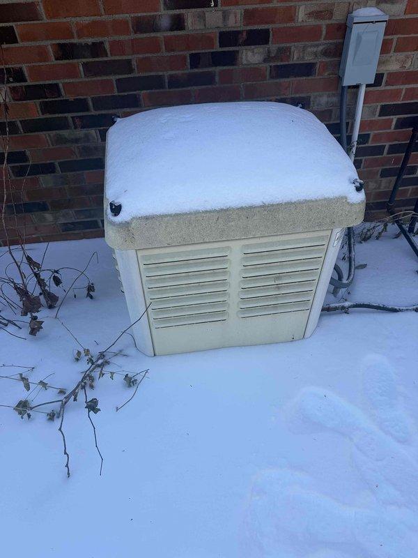 Performed service inspection on an unregistered Generac generator (Serial #6259212). Observed significant snow accumulation on the unit requiring clearance for proper ventilation. Noted corrosion on internal components and electrical connections requiring cleaning and treatment. Serviced engine assembly and verified all connections were secure and operational.