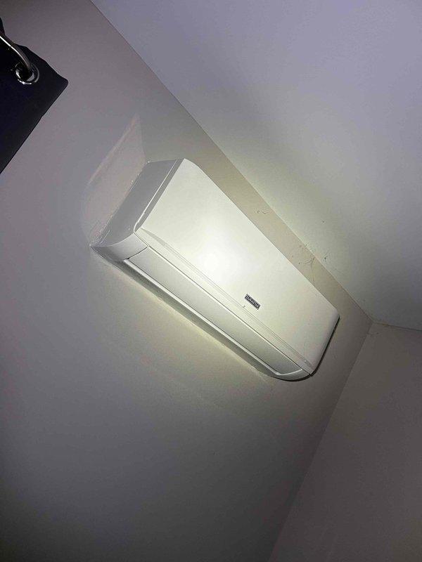 Responded to service call for mini-split system displaying PC03 error code and not providing heat. Inspected the wall-mounted indoor air handler and examined the multi-zone split heat system's specification labels and wiring connections. Determined error was caused by communication failure between indoor and outdoor units. Restored system functionality by cleaning terminal connections and resetting the control board, successfully resolving the heating issue.