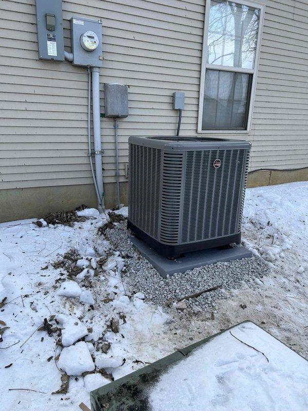 Successfully installed a complete RUUD Heat Pump System including a 3.5-ton outdoor heat pump unit (RP14AY42AJ2NA), attic-mounted air handler (RH2TY4821STANNJ), 15KW heat kit (RXBH-1724A15J-B), and digital thermostat. System installation included all necessary components: outdoor pad with snow legs, electrical connections with disconnect box and whip kit, refrigerant line insulation and filter, condensate trap with SS2 coil drain safety water sensor, overflow drain pan with "Ceiling Saver" water sensor, and transition to existing ductwork.