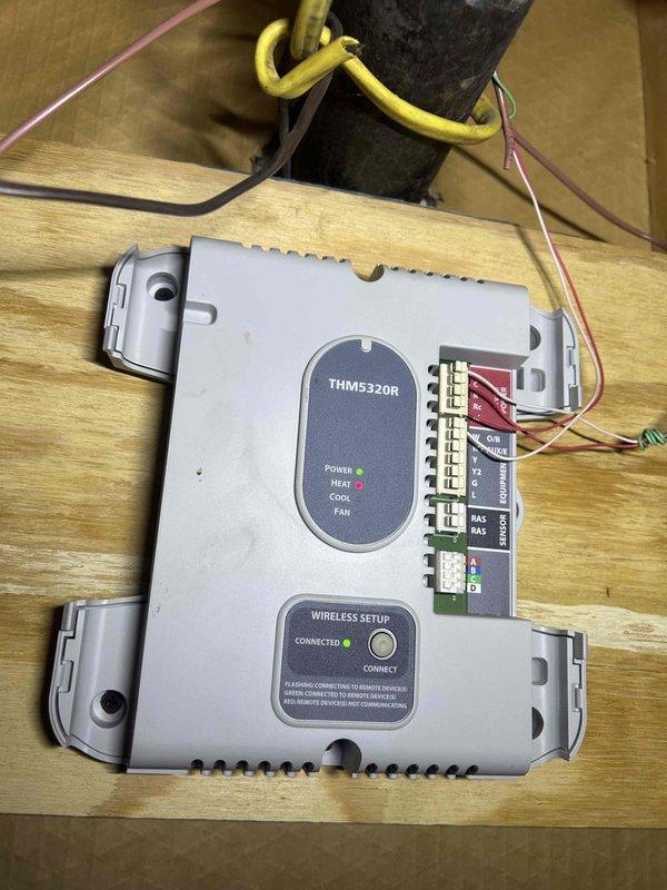 Responded to no heat call for 3-year-old Weil-McLain EVG 220 boiler system. Diagnosed issue with THM5320R wireless thermostat controller which was not properly communicating with the boiler control module. Rewired terminal connections and restored proper communication between thermostat and boiler system, returning heat functionality to the residence. System now operating normally with proper temperature readings on boiler display (84°F output, 77°F system temperature).