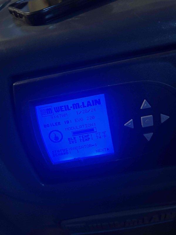 Responded to no heat call for 3-year-old Weil-McLain EVG 220 boiler system. Diagnosed issue with THM5320R wireless thermostat controller which was not properly communicating with the boiler control module. Rewired terminal connections and restored proper communication between thermostat and boiler system, returning heat functionality to the residence. System now operating normally with proper temperature readings on boiler display (84°F output, 77°F system temperature).