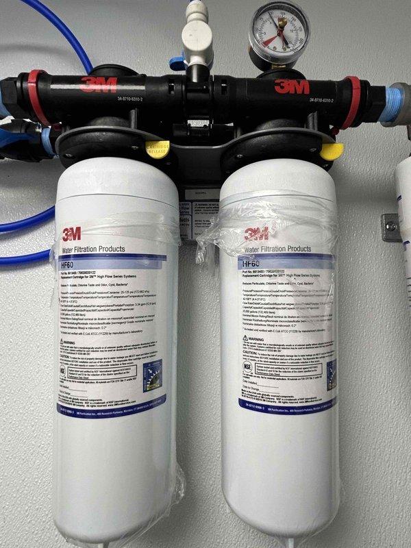 Responded to service call for leak on water filtration system. Inspected 3M dual-filter setup (HF60 and HF-CL models) and identified leaking connection point. Repaired leak by replacing faulty fitting and applying appropriate sealing material to copper plumbing component. Verified system functionality and proper pressure at completion.