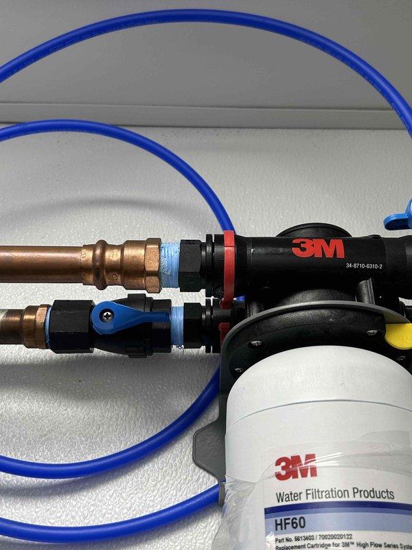 Responded to service call for leak on water filtration system. Inspected 3M dual-filter setup (HF60 and HF-CL models) and identified leaking connection point. Repaired leak by replacing faulty fitting and applying appropriate sealing material to copper plumbing component. Verified system functionality and proper pressure at completion.