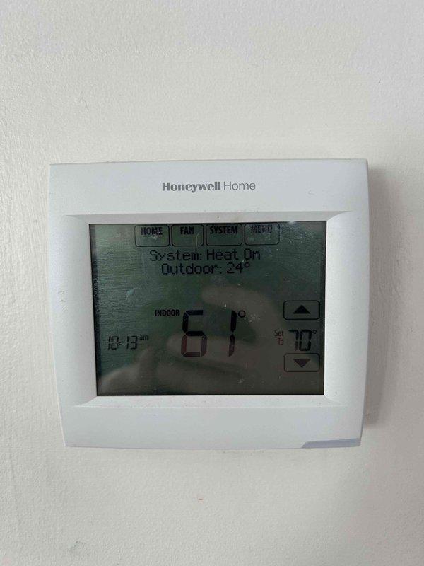 Responded to no heat call for 2-year-old heat pump system. Diagnostic testing revealed system was attempting to operate on auxiliary heat mode due to customer being out of propane. Temperature readings confirmed 61° indoor temperature with thermostat set to 70°. Verified proper operation of electrical components and reset system to restore heat function.
