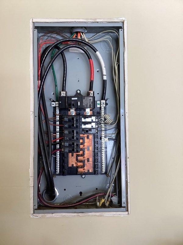 Conducted comprehensive inspection of electrical service panel for generator installation compatibility. Examined existing breaker configuration, bus bar capacity, and available spaces for new circuit installation. Evaluated wire routing options and load distribution to determine optimal connection point for standby generator system.