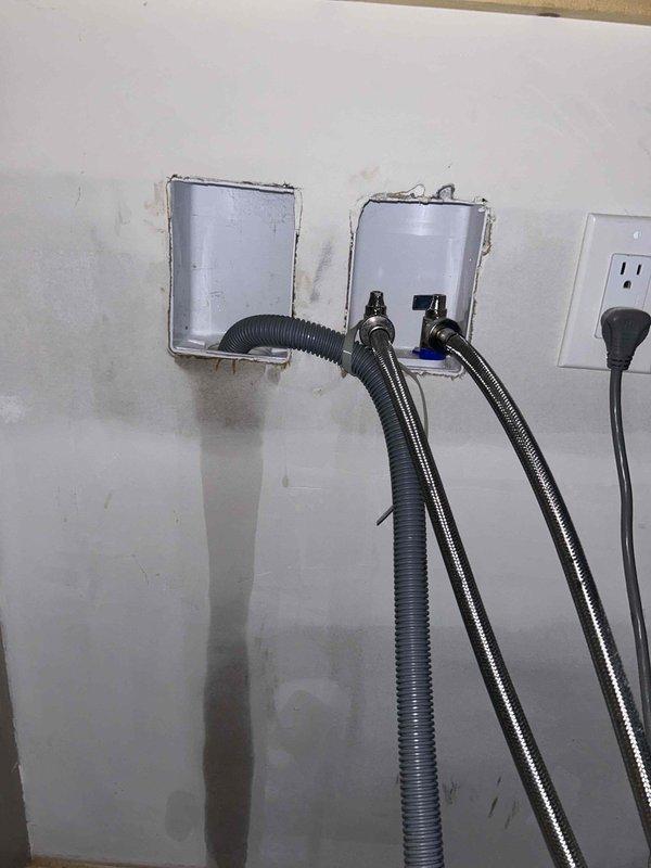 Responded to service call for burst pipe. Upon inspection, identified water supply line issue at washing machine hookups. Replaced damaged stainless steel braided supply hoses at the hot/cold water connection plate and verified proper installation of recessed utility boxes. Confirmed no leaks after repair and system functionality restored.