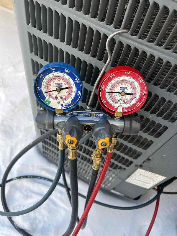 Responded to customer complaint of excessive noise from HVAC system at new residence. Performed diagnostic testing using pressure gauge manifold on outdoor condensing unit to evaluate refrigerant pressures. Readings from both high and low side gauges were analyzed to determine system operation parameters and identify the source of the unusual noise.
