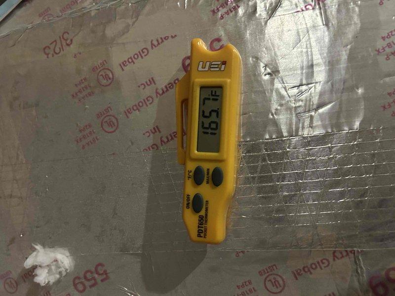 Responded to no-heat service call on a 2-year-old Carrier electric system. Diagnostic testing revealed heat exchanger temperature of 165°F, confirming proper operation. Inspected attic-located indoor unit and verified system functionality. Recommended regular filter maintenance to prevent future issues.