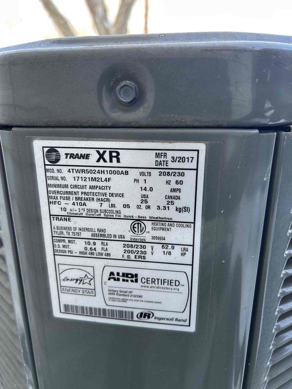 Responded to customer's peace of mind call regarding heat pump not engaging while emergency heat was functioning. Inspected Trane XR heat pump system (Model 4TWR5024H1000AB, manufactured 03/2017) and found disconnect switch in OFF position. Restored power to unit, verified proper operation of heat pump, and confirmed system is now functioning correctly without relying on emergency heat.